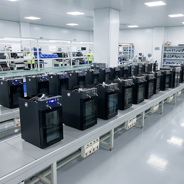 Clean factory production line with assembled wine dispensers ready for quality testing