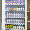 Close-up of DV5000C10 combo vending machine internal trays loaded with bottled drinks and snacks